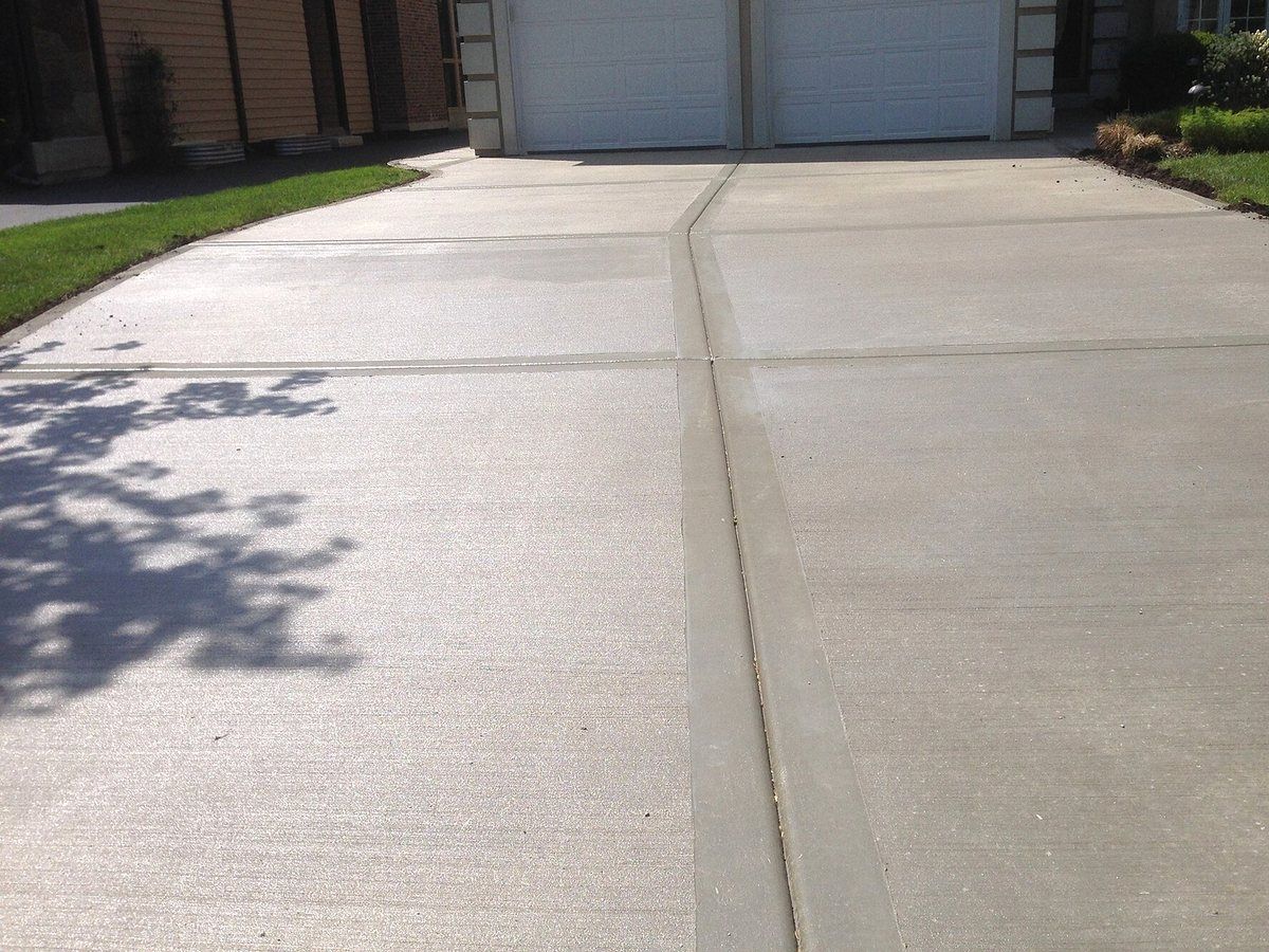 Close-up of plain concrete driveway after cleaning